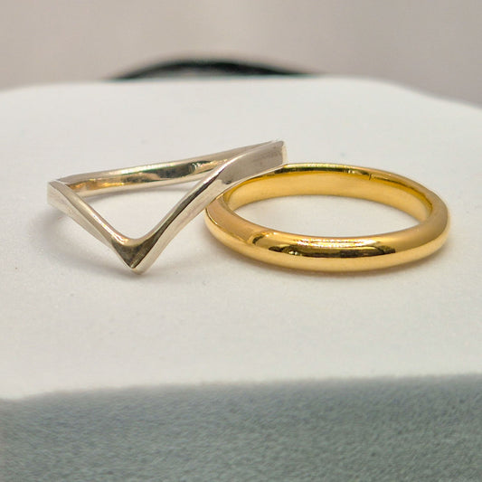 silver wishbone ring and gold wedding band