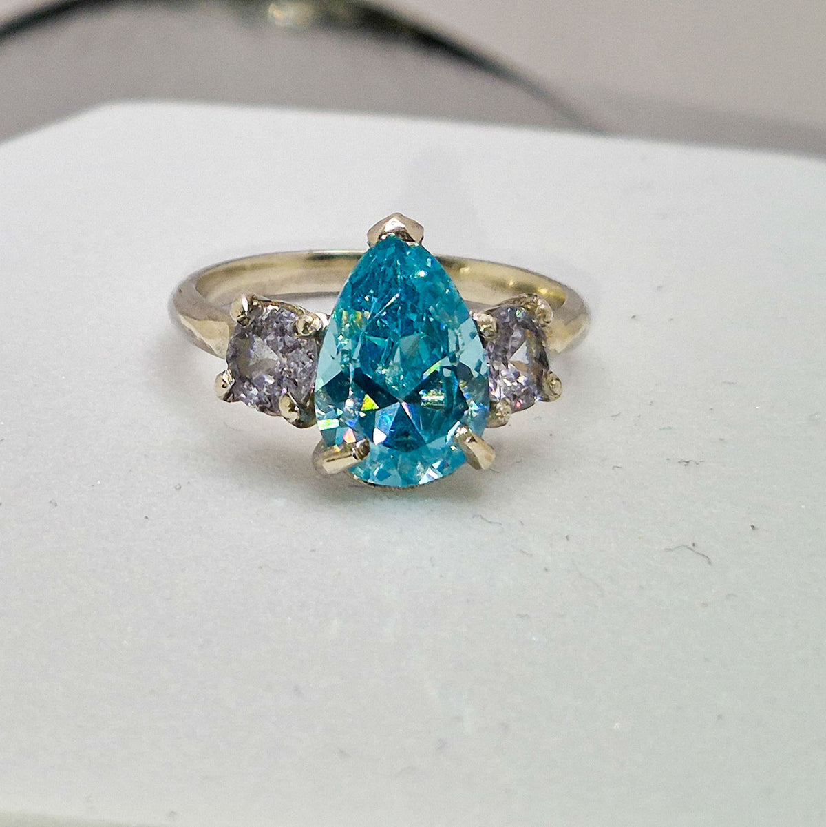 Three stone set silver ring  - pear shape stone with 2 round stones.