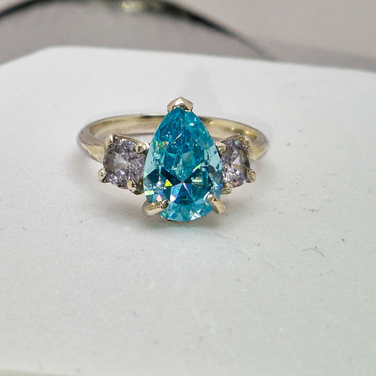 Three stone set silver ring  - pear shape stone with 2 round stones.